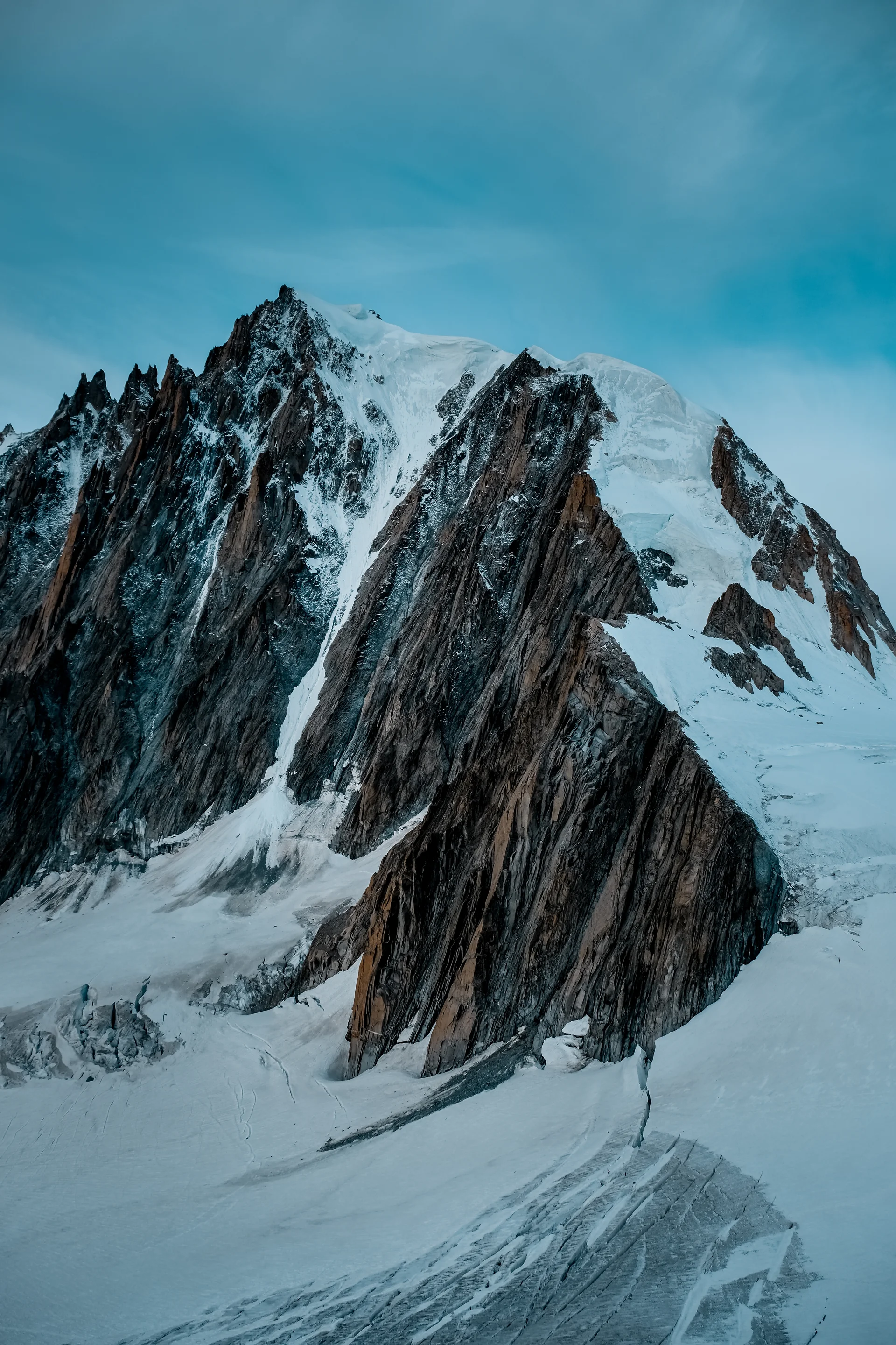 Vertical Shot Snowy Mountain With Blue Sky. Nature wallpaper. 4000×6000px. Free download for personal use.