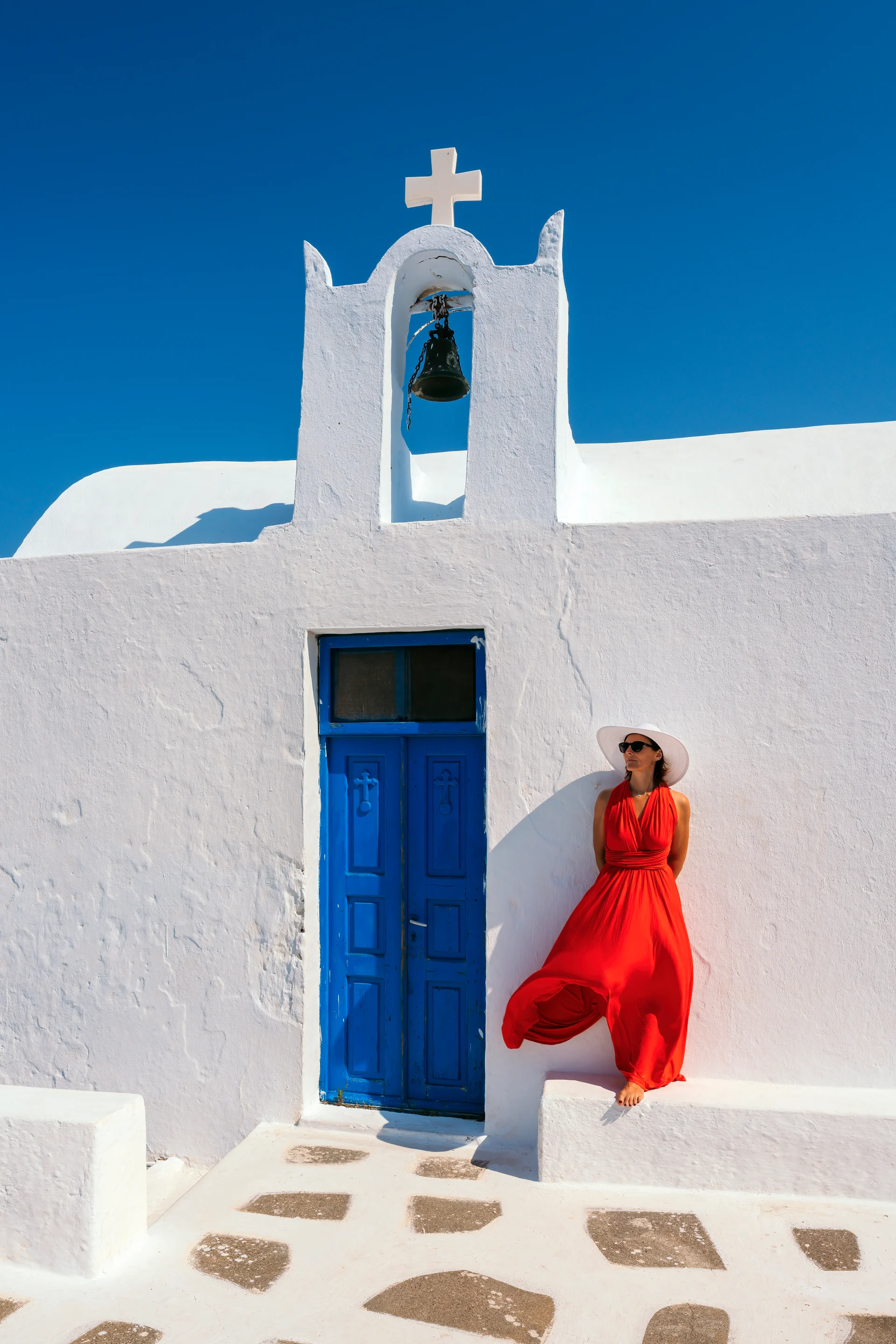 Vertical View Red Dressed Woman Oia. Aerial wallpaper. 5048×7569px. Free download for personal use.