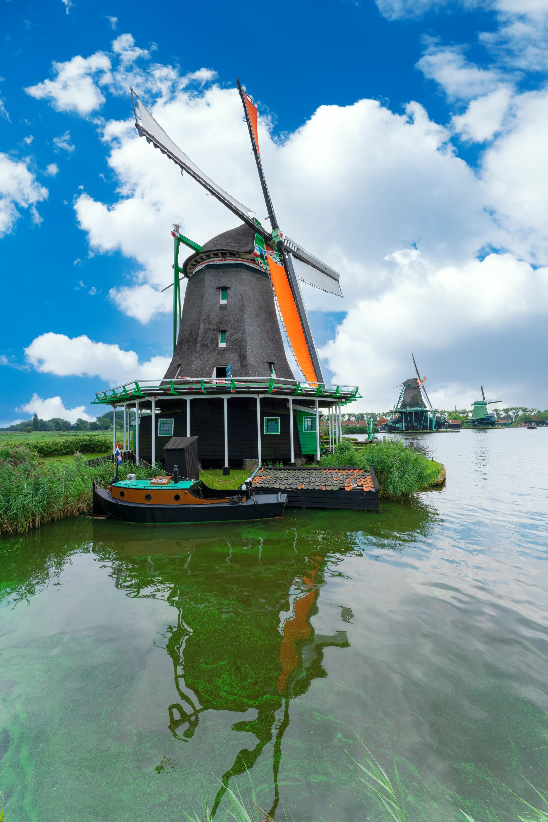View Windmill Zaanse Schans Netherlands. Aerial wallpaper. 5304×7952px. Free download for personal use.