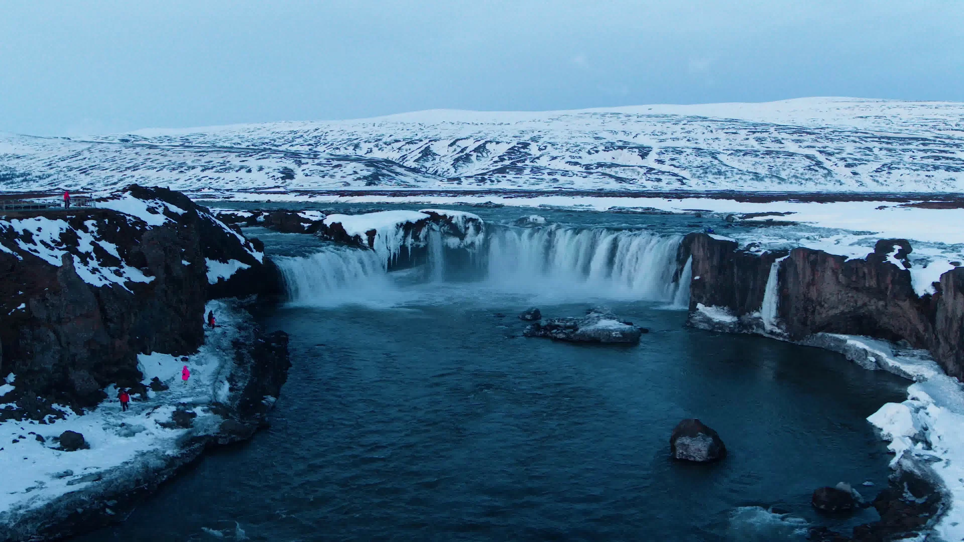 Waterfall Iceland With Snow Ground Snowy Mountain Background. Nature wallpaper. 3840×2160px. Free download for personal use.