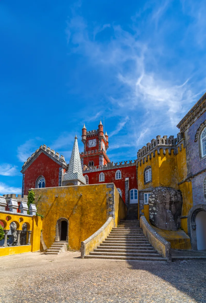 Wide View Arched Courtyard With Stone Stairs Yellow Red Painted Walls Pena Palace