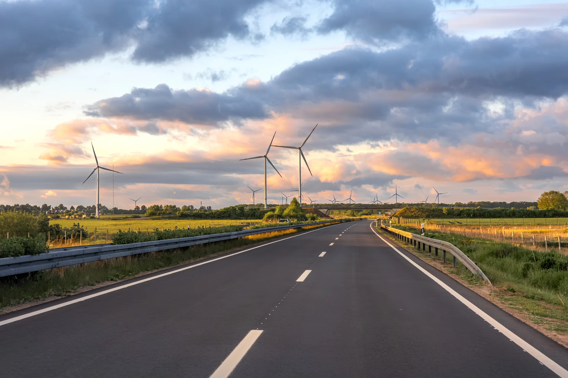 Wind Turbines Road Rural Landscape Sunset Sky. Nature wallpaper. 5472×3648px. Free download for personal use.