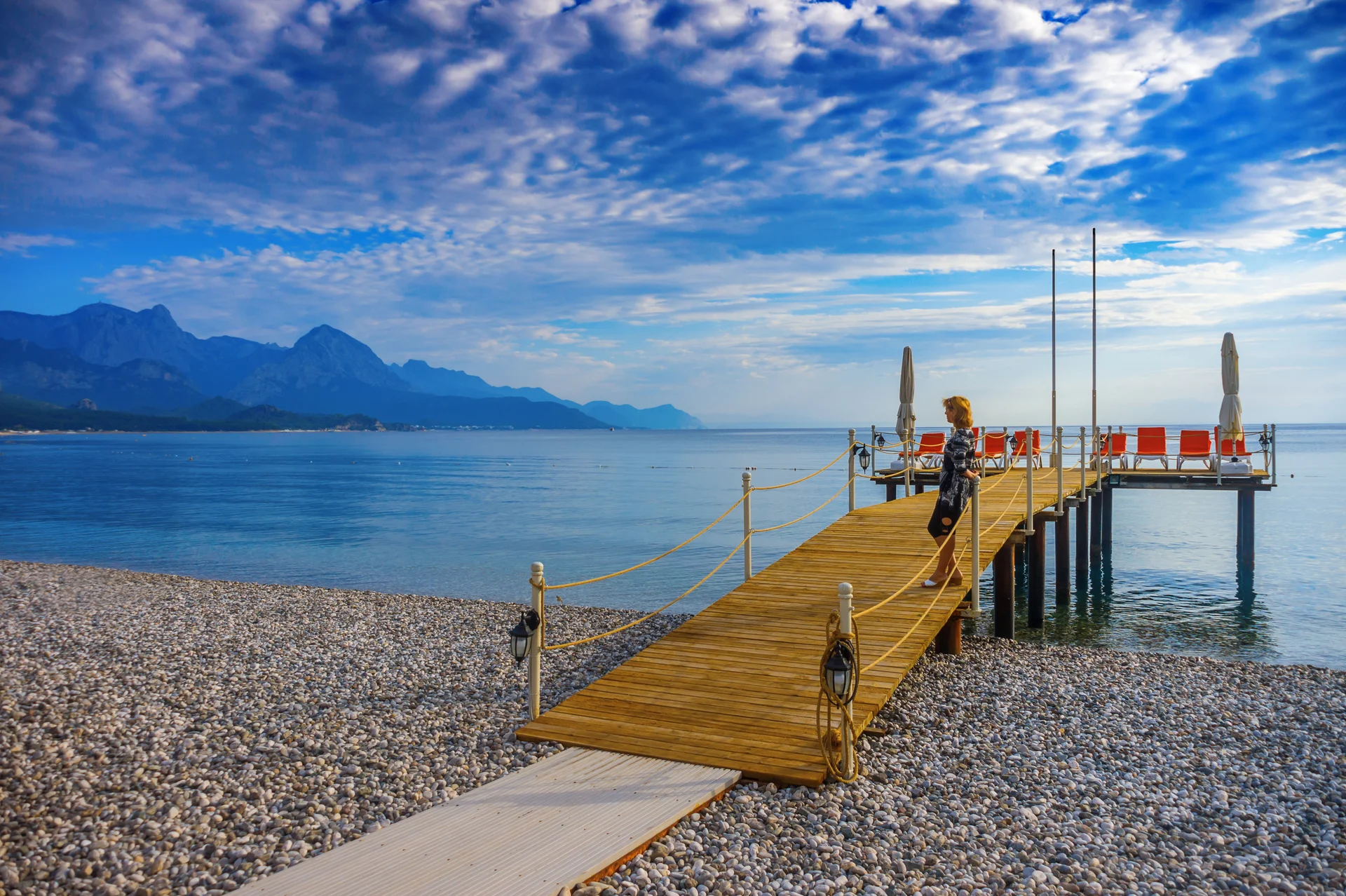 Woman Beach City Kemer Looks Mountains. Nature wallpaper. 5436×3619px. Free download for personal use.