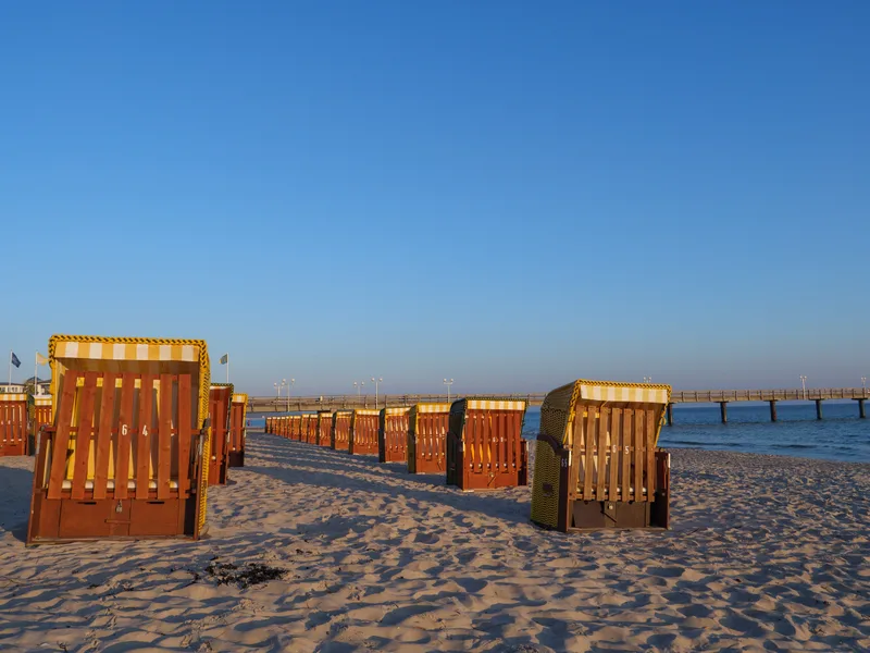 Wooden Chairs Beach Against Clear Blue Sky